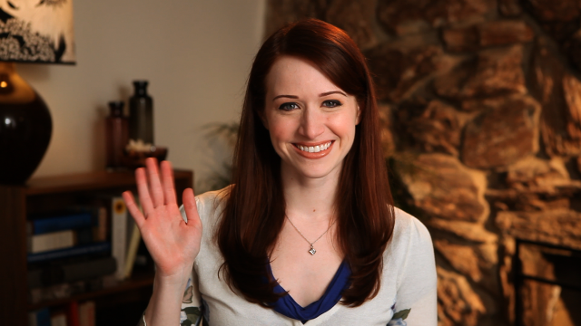 Smiling woman waving living room free wallpaper - medium preview image