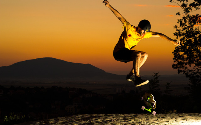 Man flying skateboard sunset park free wallpaper - medium preview image