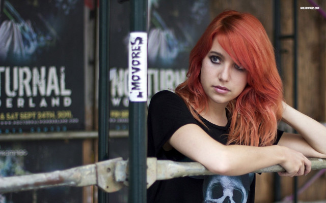 Red haired woman fence serious free wallpaper - medium preview image
