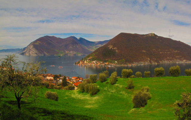 Green field village mountain distance free wallpaper - medium preview image