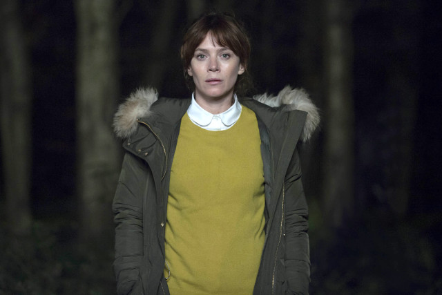 Woman green jacket woods night free wallpaper - medium preview image