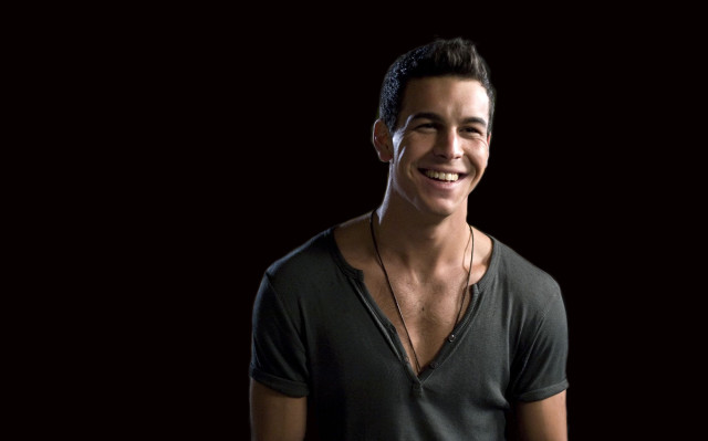 Smiling man black shirt necklace free wallpaper - medium preview image