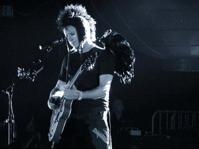 Man guitar stage concert microphone free wallpaper - medium preview image