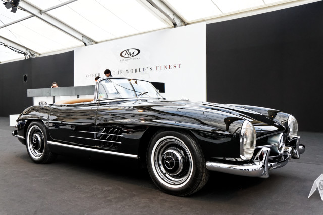 Black car showroom man woman free wallpaper - medium preview image