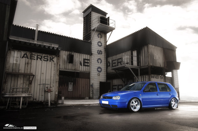 Blue car parked building clock free wallpaper - medium preview image