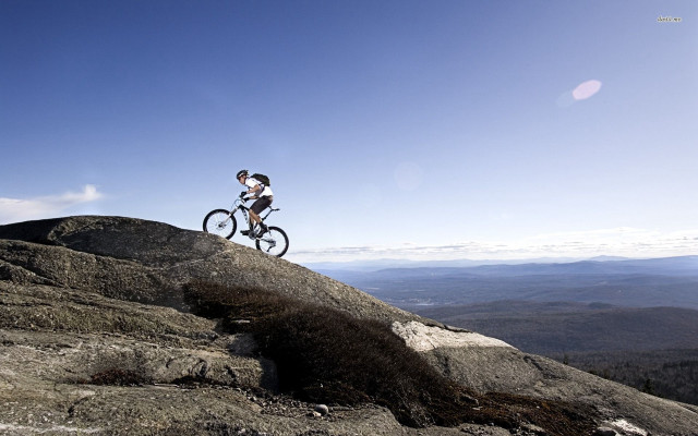 Man riding bike rocky mountain #3 free wallpaper - medium preview image