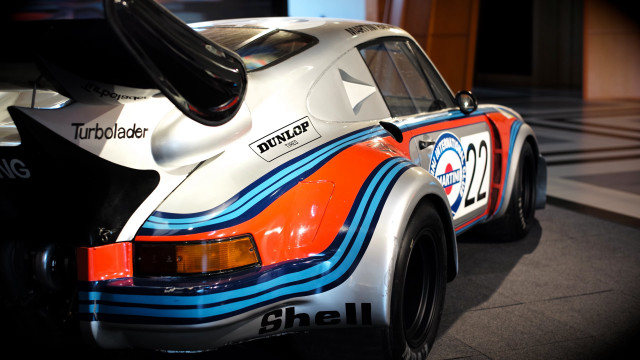 White orange race car parked free wallpaper - medium preview image