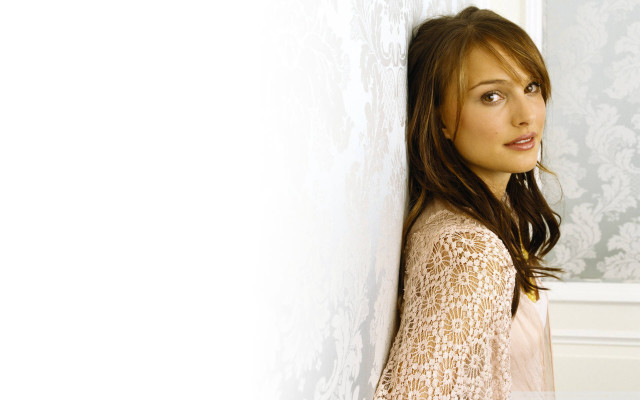 Woman leaning wall smiling looking free wallpaper - medium preview image