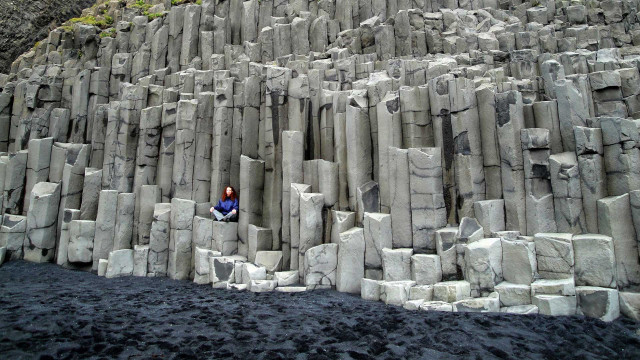 Person standing rocky cliff edge free wallpaper - medium preview image