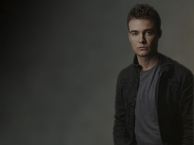 Man black jacket posing picture free wallpaper - medium preview image