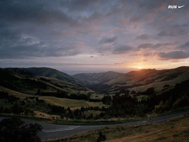 Sunset winding road mountains cloudy free wallpaper - medium preview image