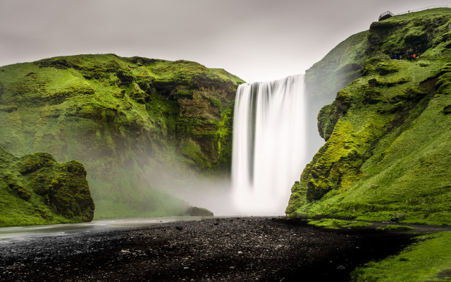 Waterfall black sand beach person free wallpaper - medium preview image