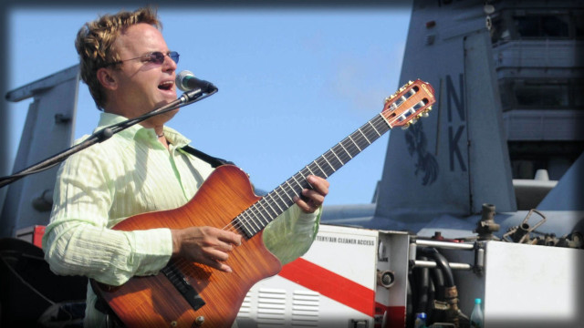 Man playing guitar microphone plane free wallpaper - medium preview image