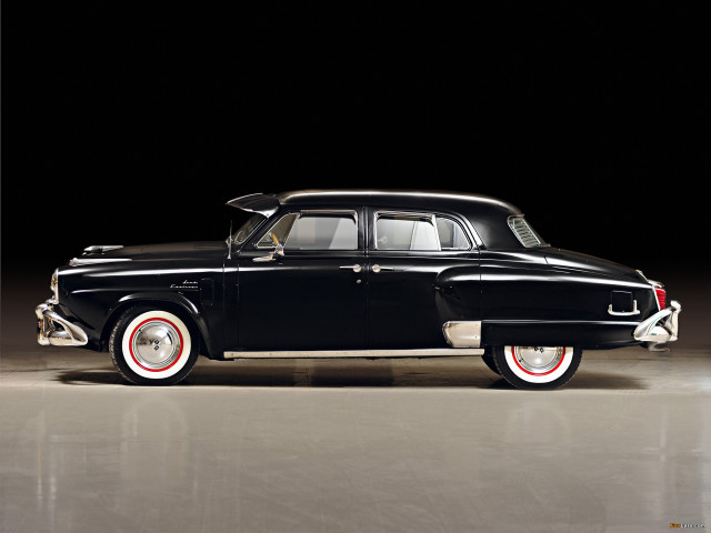 Black car red rims dark free wallpaper - medium preview image