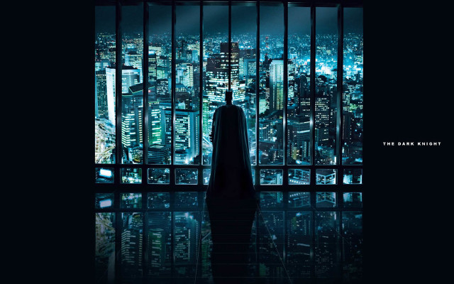 Man standing window cityscape nighttime free wallpaper - medium preview image