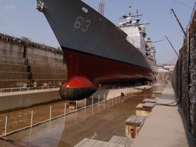Large ship docked fence man free wallpaper - medium preview image