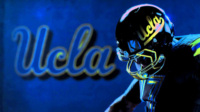 Football player helmet holding football #5 free wallpaper - medium preview image