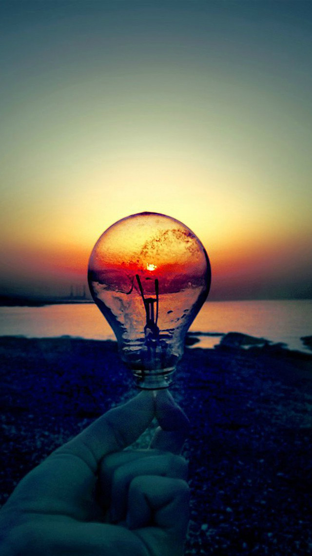 Hand lightbulb sunset water background free wallpaper - medium preview image