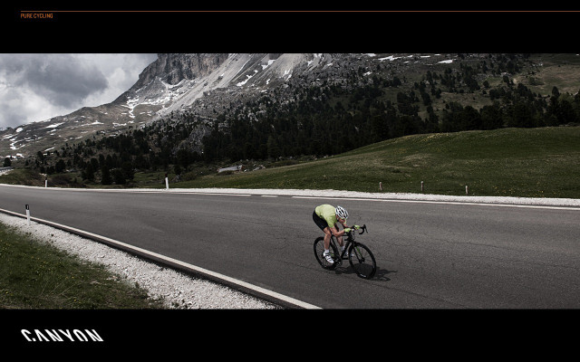 Man riding bike road mountain free wallpaper - medium preview image