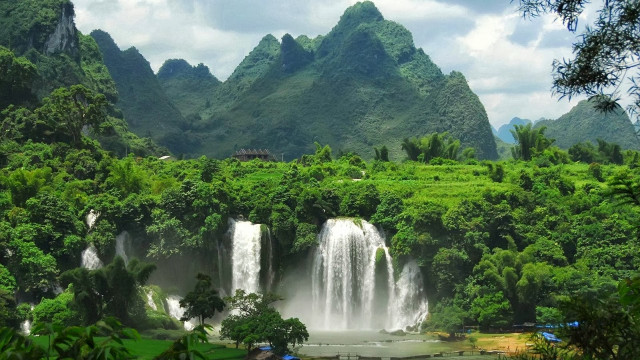 Waterfall lush forest mountain background free wallpaper - medium preview image