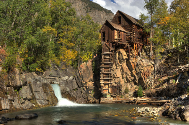 Wooden cabin cliff waterfall foreground free wallpaper - medium preview image