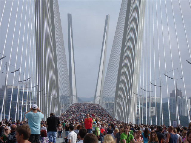 Crowd bridge water pillars skyline free wallpaper - medium preview image