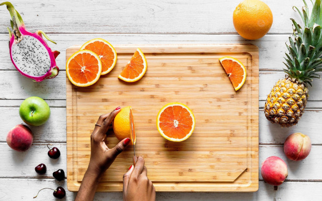 Orange cutting blue nails fruit free wallpaper - medium preview image