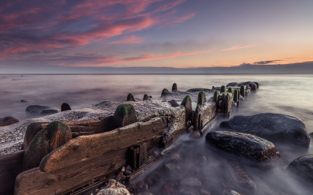Sunset rocky beach pier water free wallpaper - medium preview image