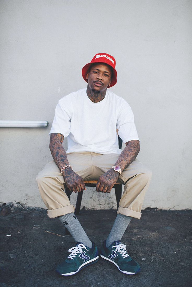 Man sitting red hat socks free wallpaper - medium preview image