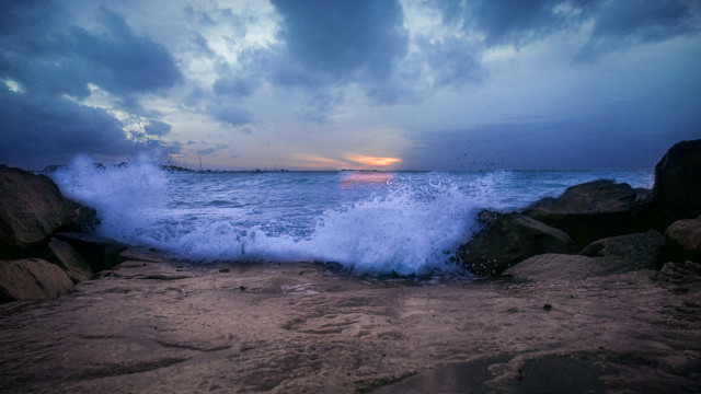 Wave rocky beach sunset lighthouse free wallpaper - medium preview image