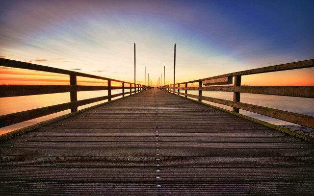 Wooden pier sunset poles mountains free wallpaper - medium preview image
