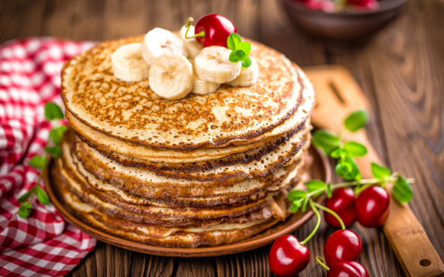 Pancakes bananas cherries wooden table free wallpaper - medium preview image