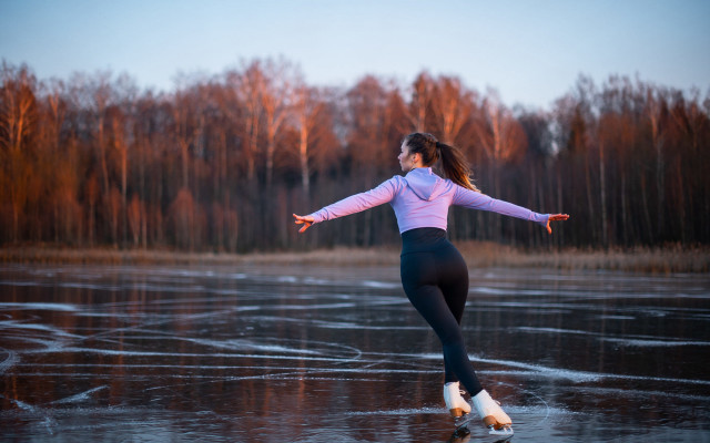 Woman skating frozen lake winter free wallpaper - medium preview image