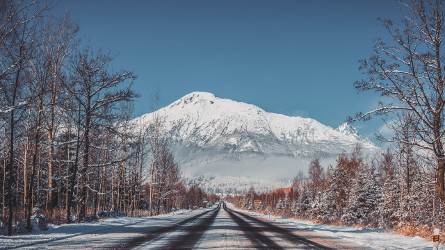 Snowy road mountains trees blue free wallpaper - medium preview image