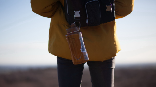 Backpack cellphone tiltshift portrait male free wallpaper - medium preview image