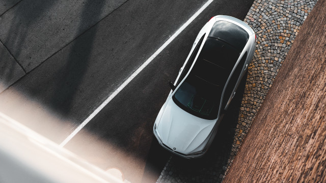 White car parking lot sidewalk free wallpaper - medium preview image
