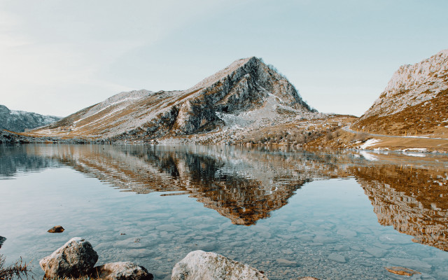Mountain lake rocks snowy mountains free wallpaper - medium preview image