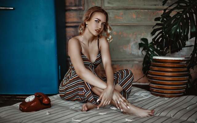 Woman sitting bed blue wall #2 free wallpaper - medium preview image