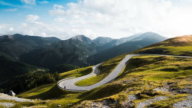 Winding road green hillside mountains free wallpaper - medium preview image