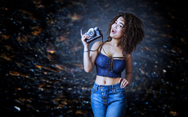 Woman camera smiling dark background free wallpaper - medium preview image