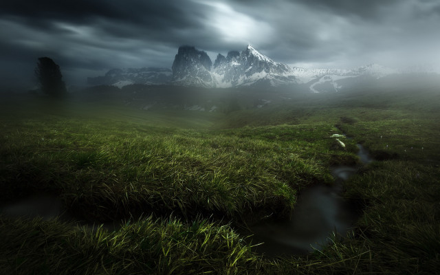 Grassy field stream cloudy mountains free wallpaper - medium preview image