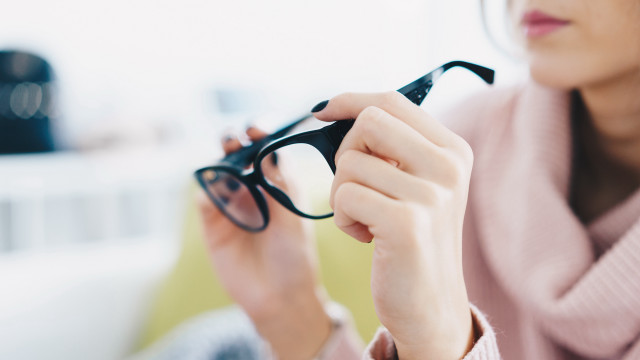 Woman glasses pink scarf holding free wallpaper - medium preview image