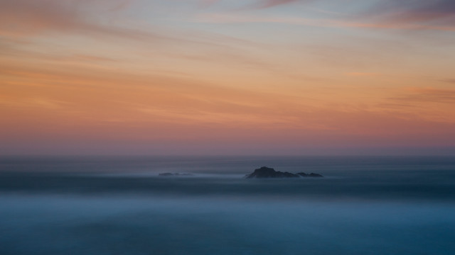 Beach rock sunset clouds impessionist free wallpaper - medium preview image