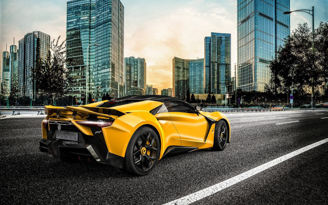 Yellow sports car cityscape night free wallpaper - medium preview image