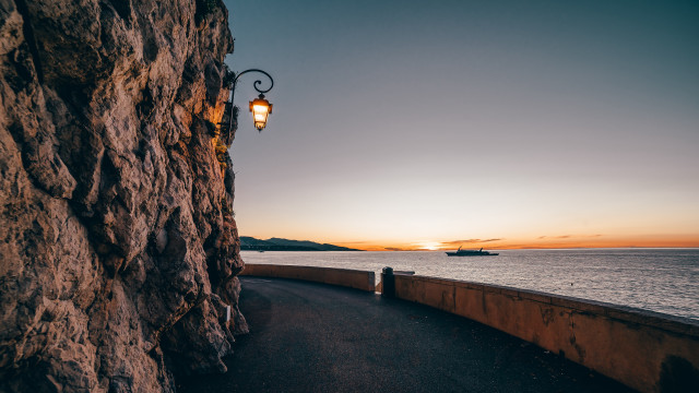Cliff side streetlight ocean sunset free wallpaper - medium preview image