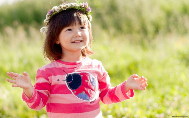 Little girl field smiling flower free wallpaper - medium preview image