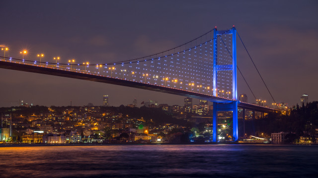 Lit bridge night cityscape reflection free wallpaper - medium preview image