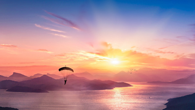 Parasailer mountain sunset water sky free wallpaper - medium preview image
