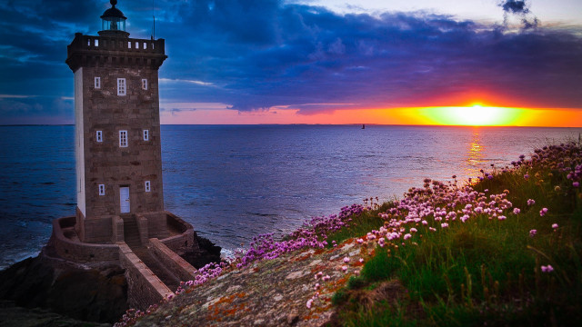 Lighthouse cliff ocean sunset boat free wallpaper - medium preview image