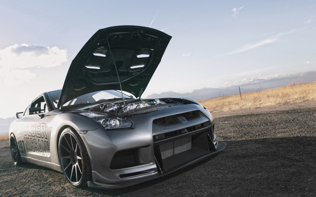 Car mountain dirt road clouds free wallpaper - medium preview image
